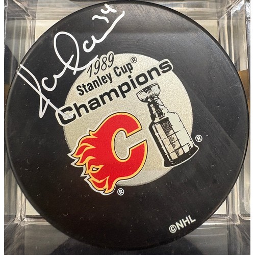 453 - Authentic Jamie Macoun and Ric Nattress signed Calgary Flames hockey puck 1989 Stanley cup champions... 