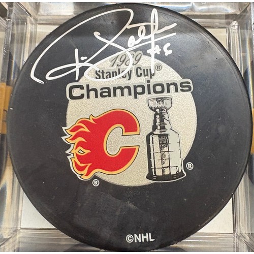 453 - Authentic Jamie Macoun and Ric Nattress signed Calgary Flames hockey puck 1989 Stanley cup champions... 