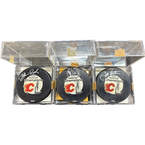 455 - Selection of 3 authentically signed Calgary Flames hockey puck 1989 Stanley cup champions with COA b... 