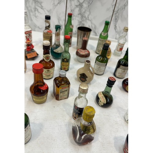 7 - Selection of miniature alcohols to include Smirnoff, Harveys, some empty