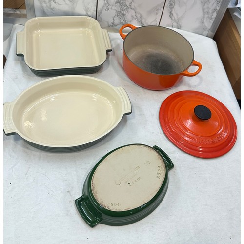 19 - Four pieces of Le Creuset a lidded pot and three varied size dishes