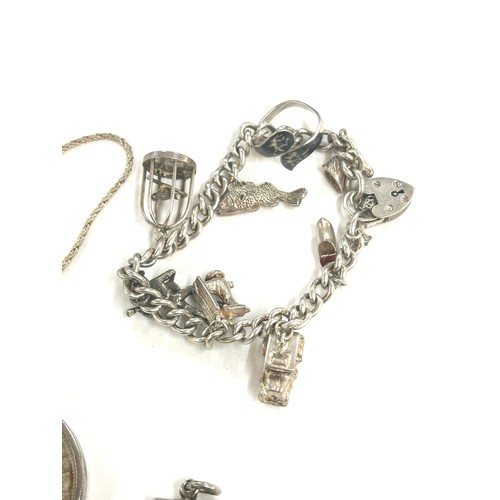 495 - Selection of silver jewellery includes Ingot, charm bracelet total weight 99grams