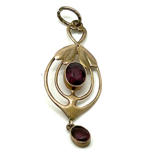 465 - 9ct gold mounted Murrle Bennett pendant set with garnets weight 1.5grams