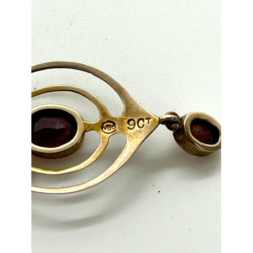 465 - 9ct gold mounted Murrle Bennett pendant set with garnets weight 1.5grams