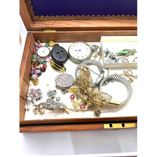 443 - Mahogany box of costume jewellery to include Pocket watch, wrist watch, coins brooches and rings etc