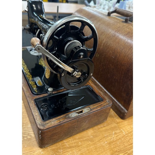 278 - Vintage cased Singer sewing machine with key