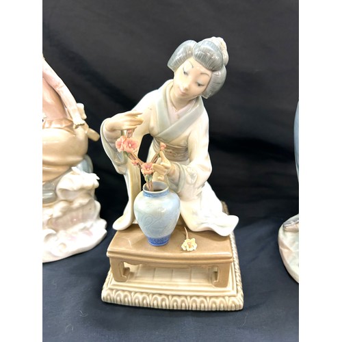 256 - Selection of Three Lladro figures includes Man with Donkey, oriental lady etc