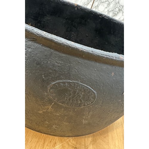 286 - Cast iron pot and sauce pan largest measures approximately 8.5 inches tall x 14 wide