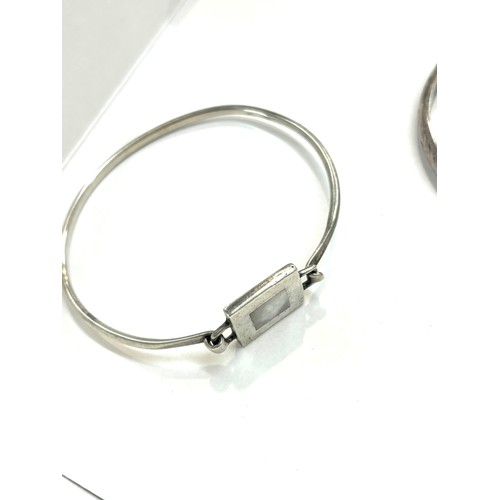 498 - Three silver bangles total weight 24g