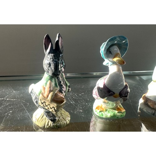 352 - Four Beswick Beatrice Potter ornaments to include ' Little Black Rabbit', ' Jemima Puddle duck', ' G... 