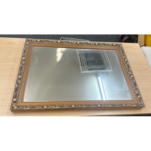 269 - Wooden gilt framed mirror measures approximately 33 wide x 23 long