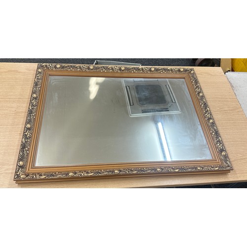 269 - Wooden gilt framed mirror measures approximately 33 wide x 23 long