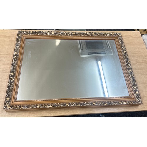 269 - Wooden gilt framed mirror measures approximately 33 wide x 23 long