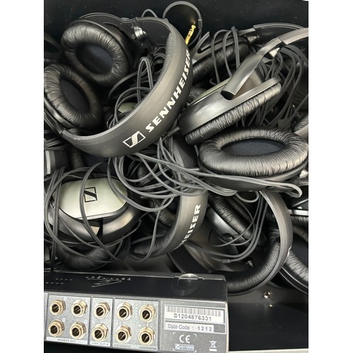 323 - Behringer Mini amp Model amp800 and a large selection of assorted head phones, all untested