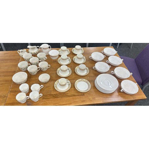 201 - Two part vintage tea services one Royal Doulton the other Wedgwood along with some soup bowls and sa... 