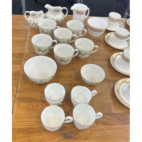 201 - Two part vintage tea services one Royal Doulton the other Wedgwood along with some soup bowls and sa... 