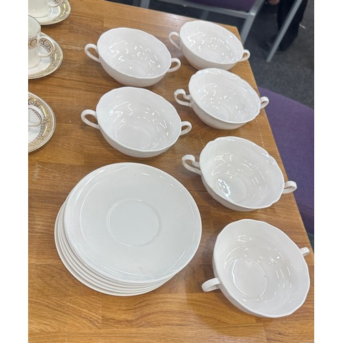 201 - Two part vintage tea services one Royal Doulton the other Wedgwood along with some soup bowls and sa... 