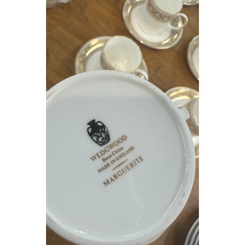 201 - Two part vintage tea services one Royal Doulton the other Wedgwood along with some soup bowls and sa... 