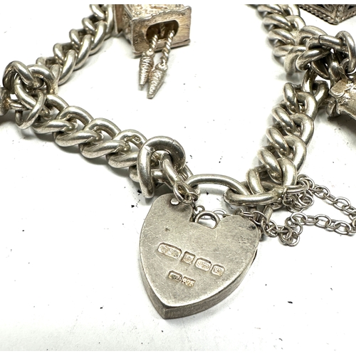 255 - Vintage silver charm bracelet and charms weight 40g