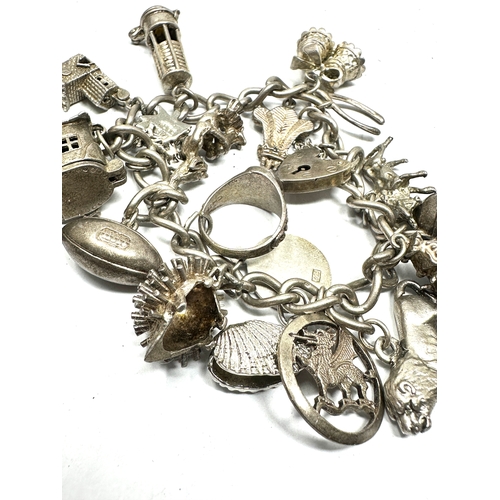 257 - Vintage silver charm bracelet and charms weight 72g