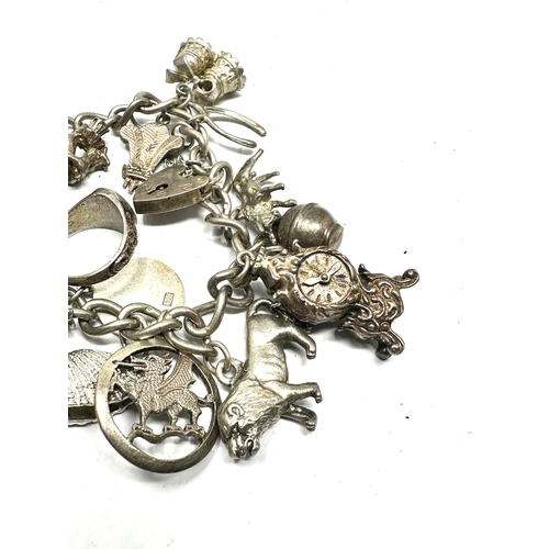 257 - Vintage silver charm bracelet and charms weight 72g