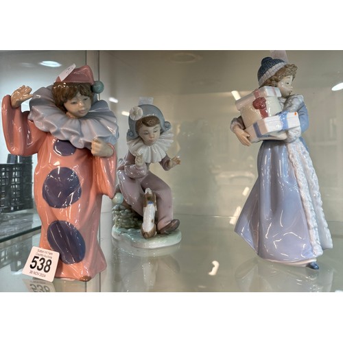 538 - Three vintage Nao figurines one ' 1985 girl with presents', ' Listen to the Harlequinn with dog' and... 