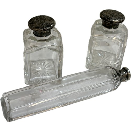 511 - Three silver topped glass scent bottles