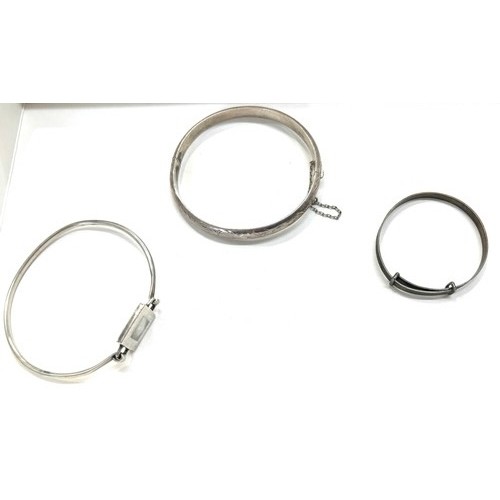 498 - Three silver bangles total weight 24g