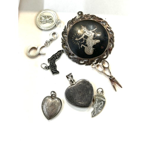 502 - Selection of assorted silver pendants, charms and lockets includes Siam silver etc