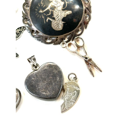 502 - Selection of assorted silver pendants, charms and lockets includes Siam silver etc