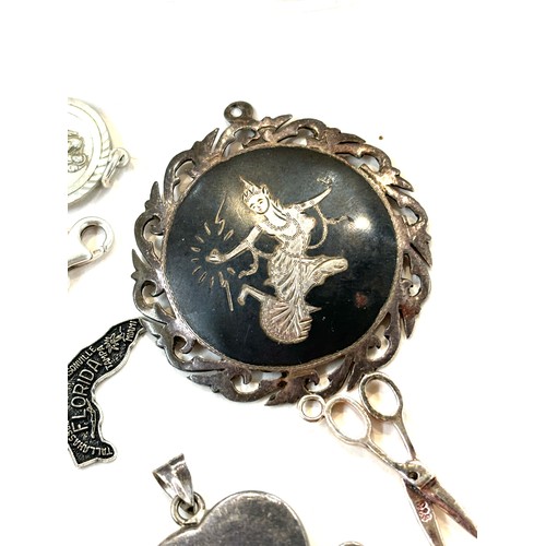 502 - Selection of assorted silver pendants, charms and lockets includes Siam silver etc