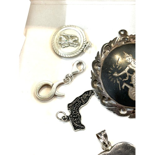 502 - Selection of assorted silver pendants, charms and lockets includes Siam silver etc