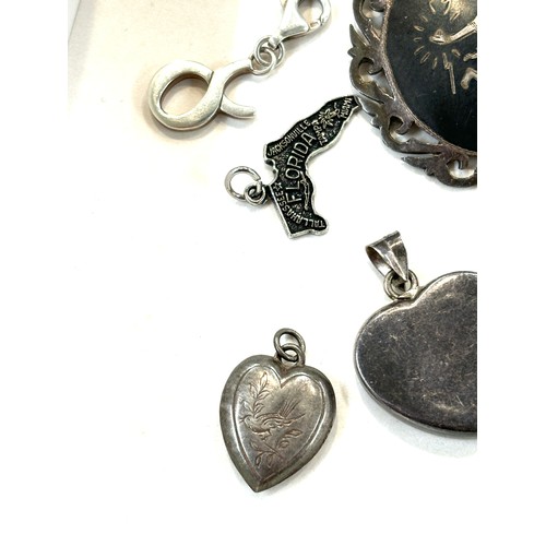 502 - Selection of assorted silver pendants, charms and lockets includes Siam silver etc