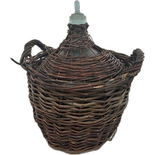 272 - Vintage demi john in a wicker basket