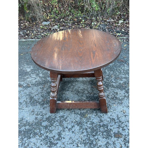 421C - Small oak lamp table measures approximately 18 inches tall 24 inches diameter