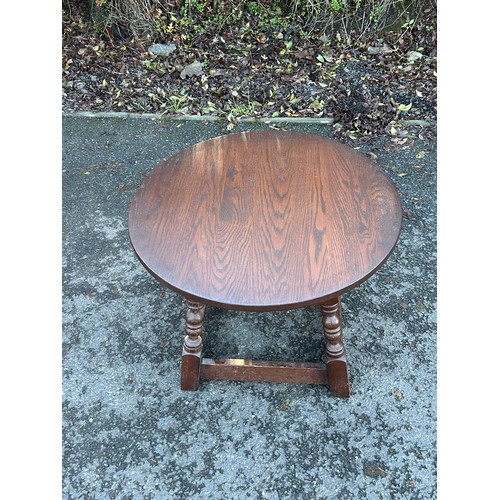 421C - Small oak lamp table measures approximately 18 inches tall 24 inches diameter