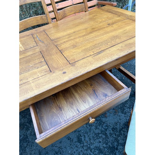 421F - Distressed Solid 2 Drawer oak  table and 6 chairs with leaf table measures 29 inches tall 91 inches ... 