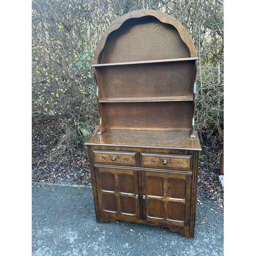 421G - 2 Door oak dutch topped dresser measures approximately 70 inches tall 36 inches wide 16 inches depth