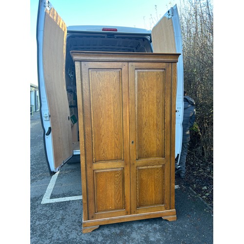 421J - 2 Door light oak wardrobe measures approximately 78 inches tall 44 inches wide 24 inches depth