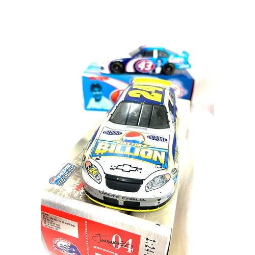 51 - Selection of four original boxed diecast vehicles 'Action' ,' Raced Version 1:24 Scale Stock Cars'