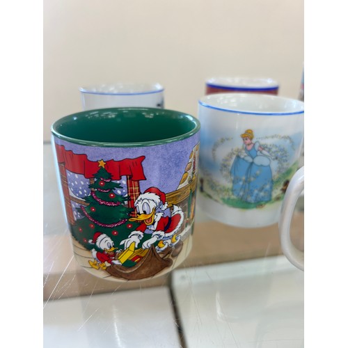 48 - Selection of Disney mugs and Royal Doulton Snowman mugs