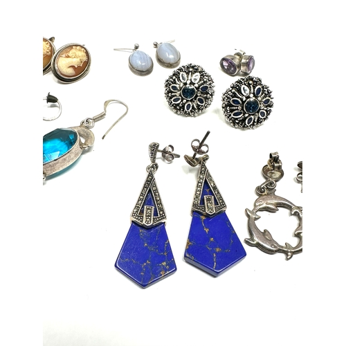 264 - 8 pairs of vintage silver earrings