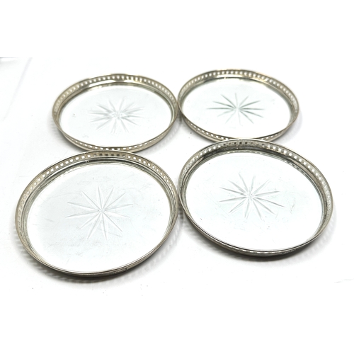 29 - 4 vintage silver and cut glass coasters measure approx 8.2cm dia