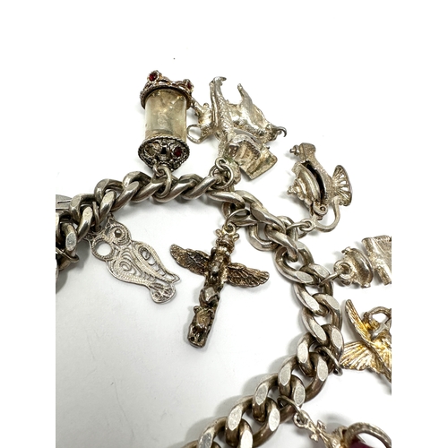 270 - Vintage silver charm bracelet inc opening charms weight 65g