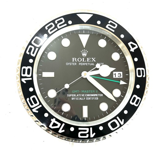 39 - Rolex wall clock in working order- crack to glass