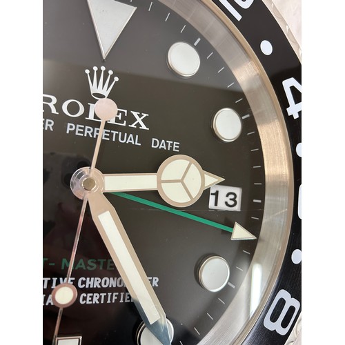 39 - Rolex wall clock in working order- crack to glass