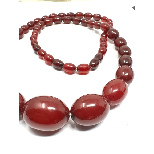 96 - Cherry Amber / bakelite bead necklace lagest bead measures approx 26mm by 19mm length 78cm long weig... 