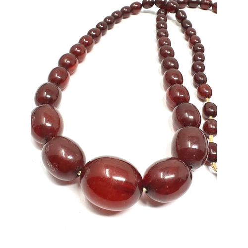 97 - Cherry Amber / bakelite bead necklace lagest bead measures approx 26mm by 19mm length 78cm long weig... 