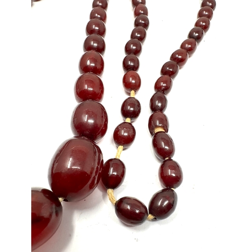 97 - Cherry Amber / bakelite bead necklace lagest bead measures approx 26mm by 19mm length 78cm long weig... 