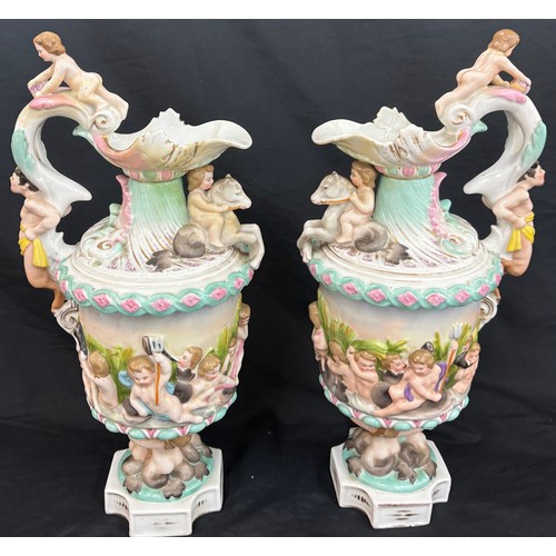 69 - Pair Christian Nonne style Volkstedt porcelain ewer / pitcher, both have been repaired to spout, ove... 